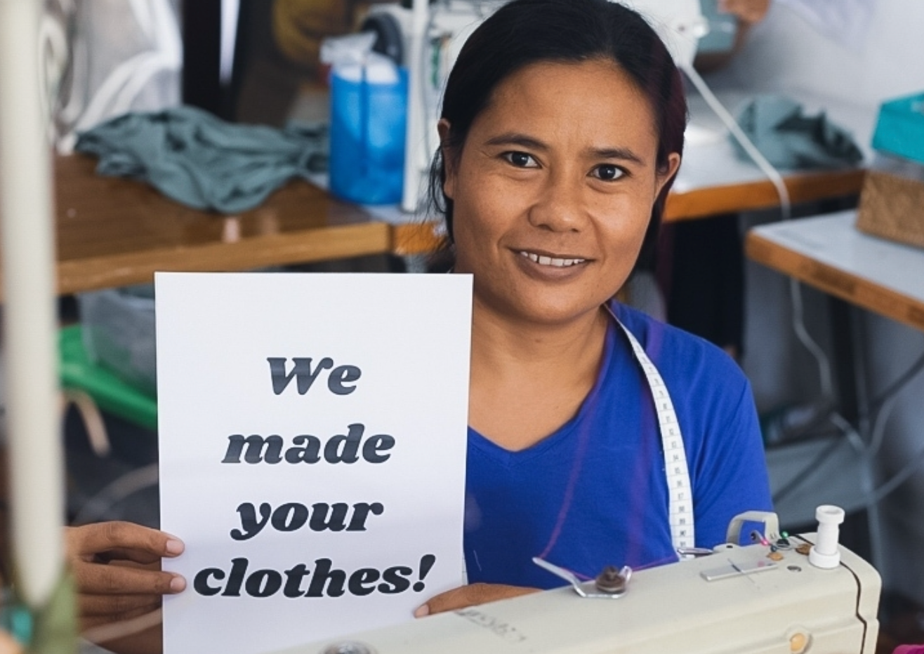 Ethical and sustainable manufacturer shows 'We made your clothes!' sign 